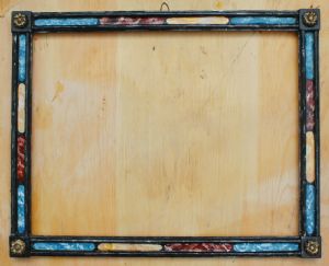 Originale cornice in legno ebanizzato con inserti di vari finti marmo.Luce cm.35 x 46